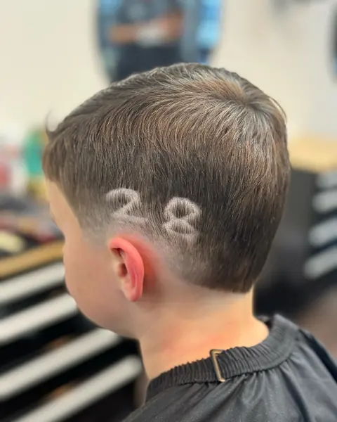 A number 28 shaved into the side of a boy's haircut