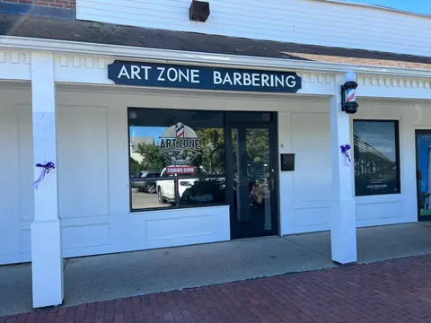 The Art Zone Barbering storefront on Chestnut Street, navy sign over a white front